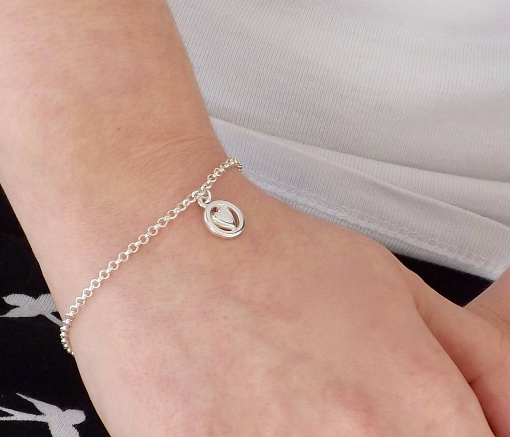 Heart of the Chapel Charm Bracelet on wrist